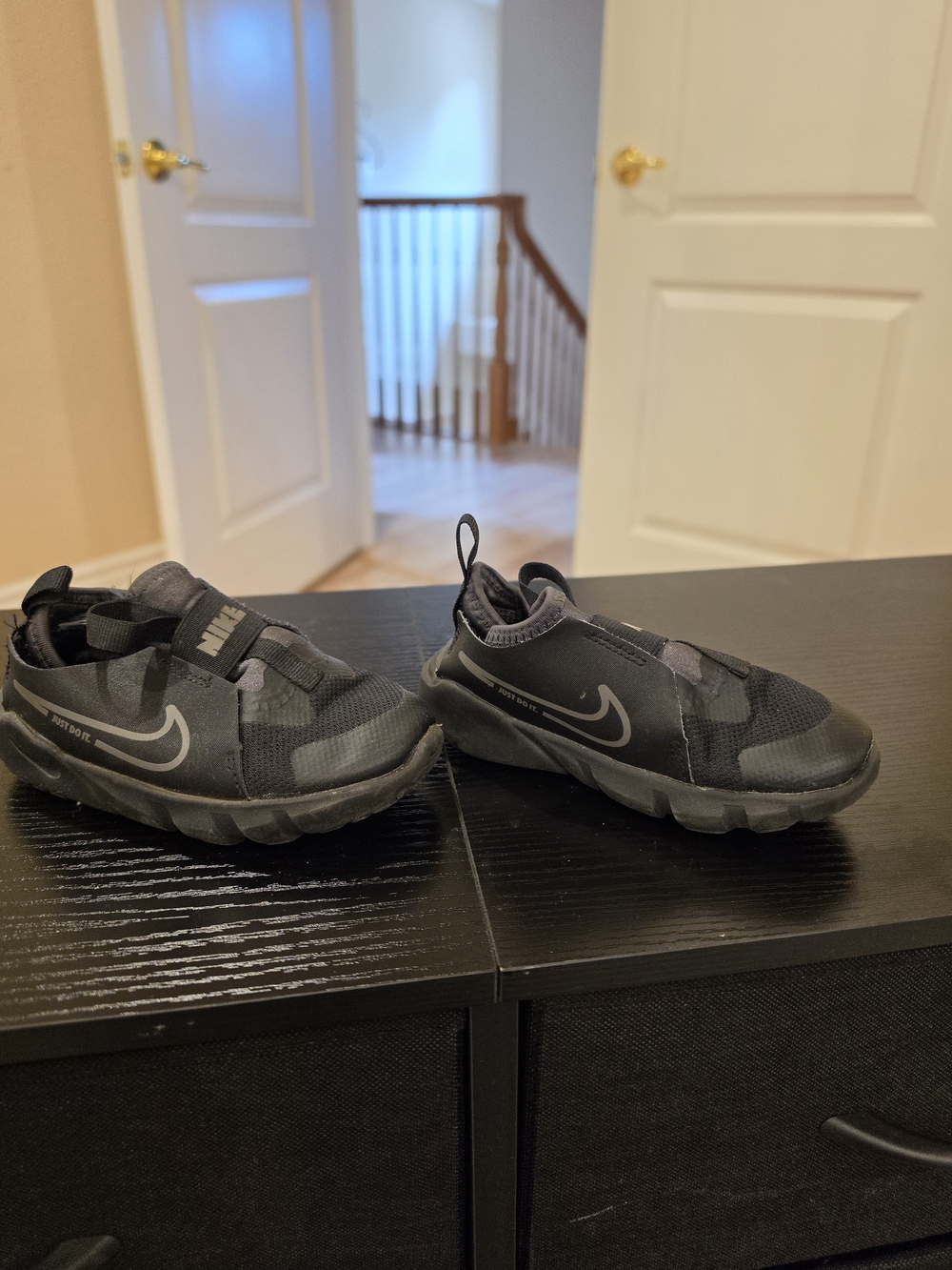 Nike Kids Black Slip-On Athletic Sneakers with Reflective Swoosh